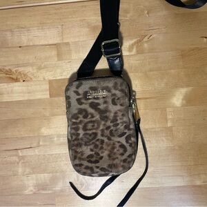 Aimee Kestenberg Leather Mobile crossbody bag with animal print on front.